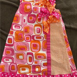 Bonnie Jean Pink and Orange Geometric Bib with Bows